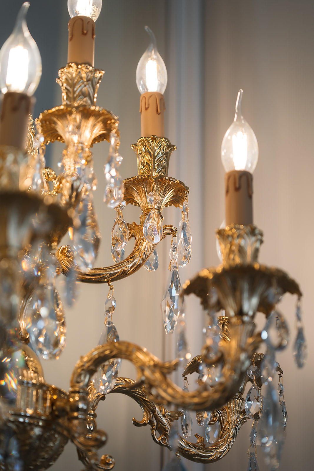 Ornate chandelier above a formal salon